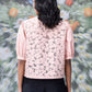 Stylera pink lace back casual semi fit top for women with puff sleeves shown from back
