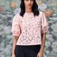 casual semi fit top for women light pink floral lace front with puff sleeves and round neckline modeled with black pants