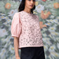 Stylera pale pink textured casual semi fit top for women with puff sleeves and crew neck styled with black pants