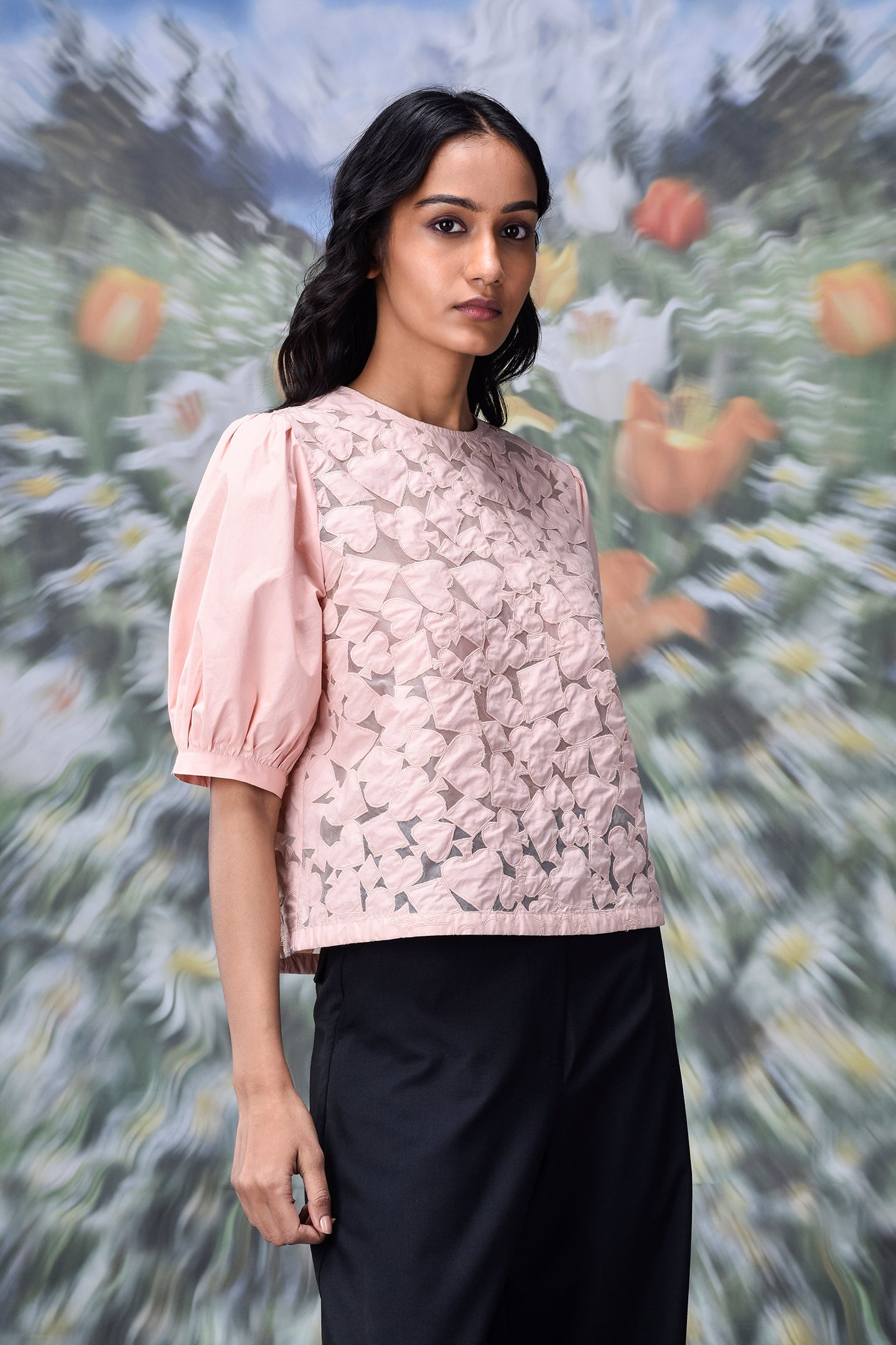 Stylera pale pink textured casual semi fit top for women with puff sleeves and crew neck styled with black pants