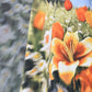 Stylera casual sleeveless dress floral print with orange lilies and green meadow pattern