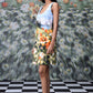 Stylera model wearing casual sleeveless dress floral knee length with orange lily print