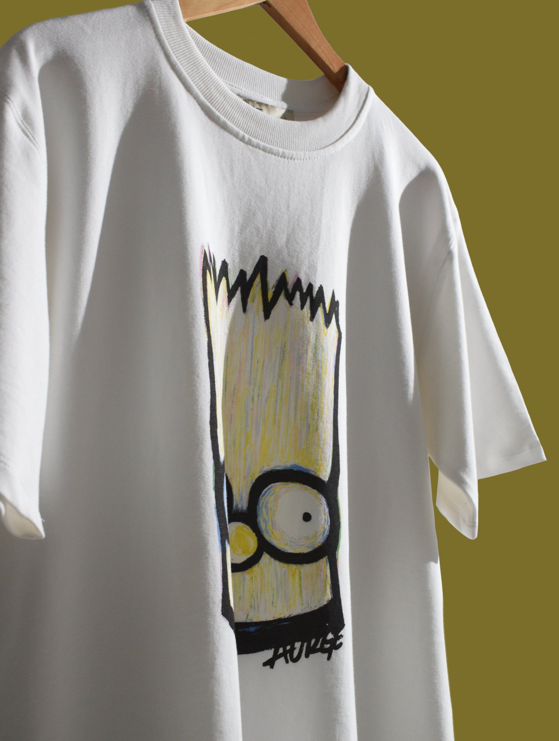 Stylera casual statement t-shirt for men and women featuring a colorful Bart Simpson graphic.