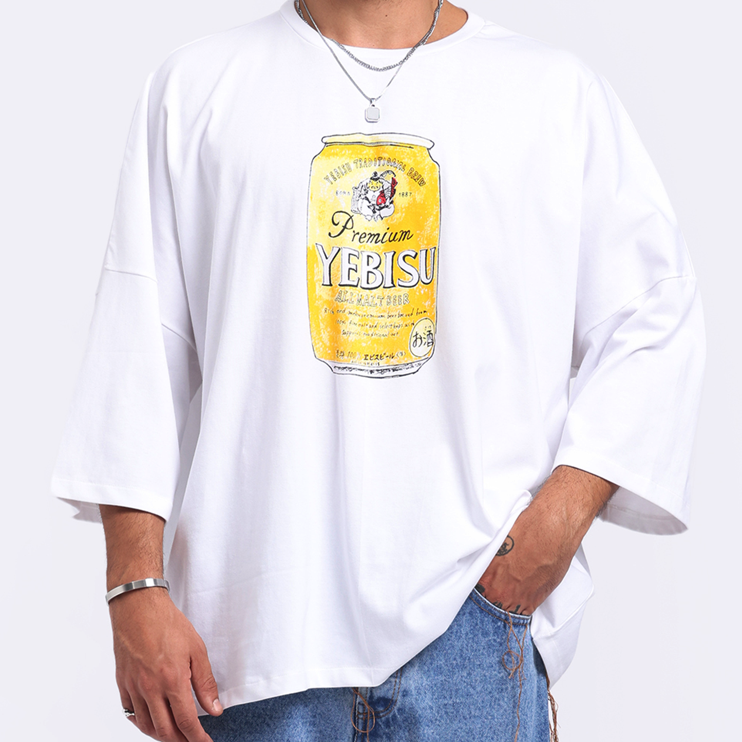 Stylera casual streetwear t-shirt featuring a large yellow Yebisu beer graphic on a white background