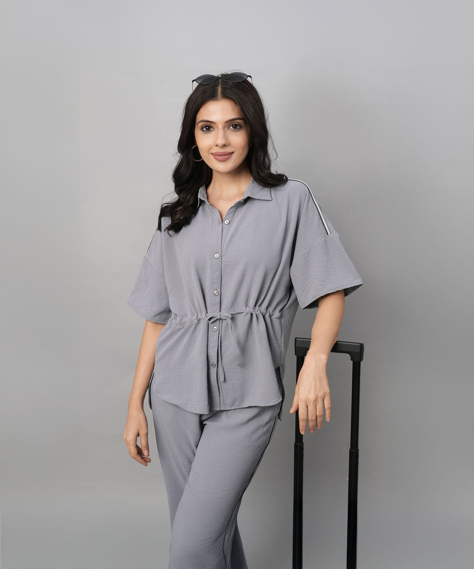 Gray casual two piece outfit for women featuring a button-up top and matching pants