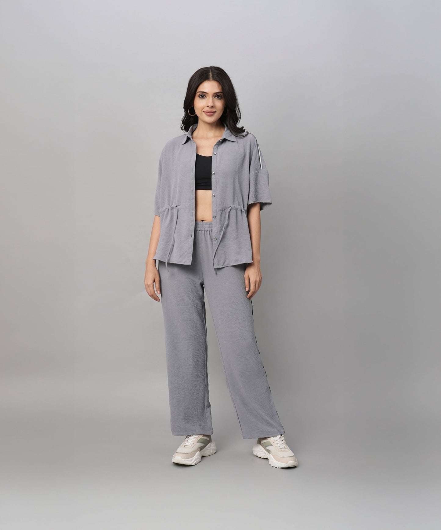 Stylish gray casual two piece outfit for women featuring a relaxed shirt and wide-leg pants