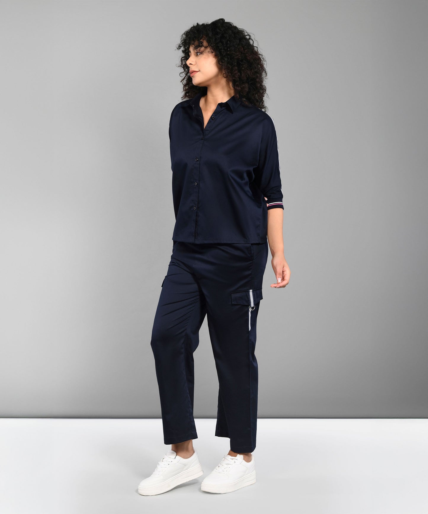 Casual women's matching set navy with a button-up top and stylish trousers for a chic look