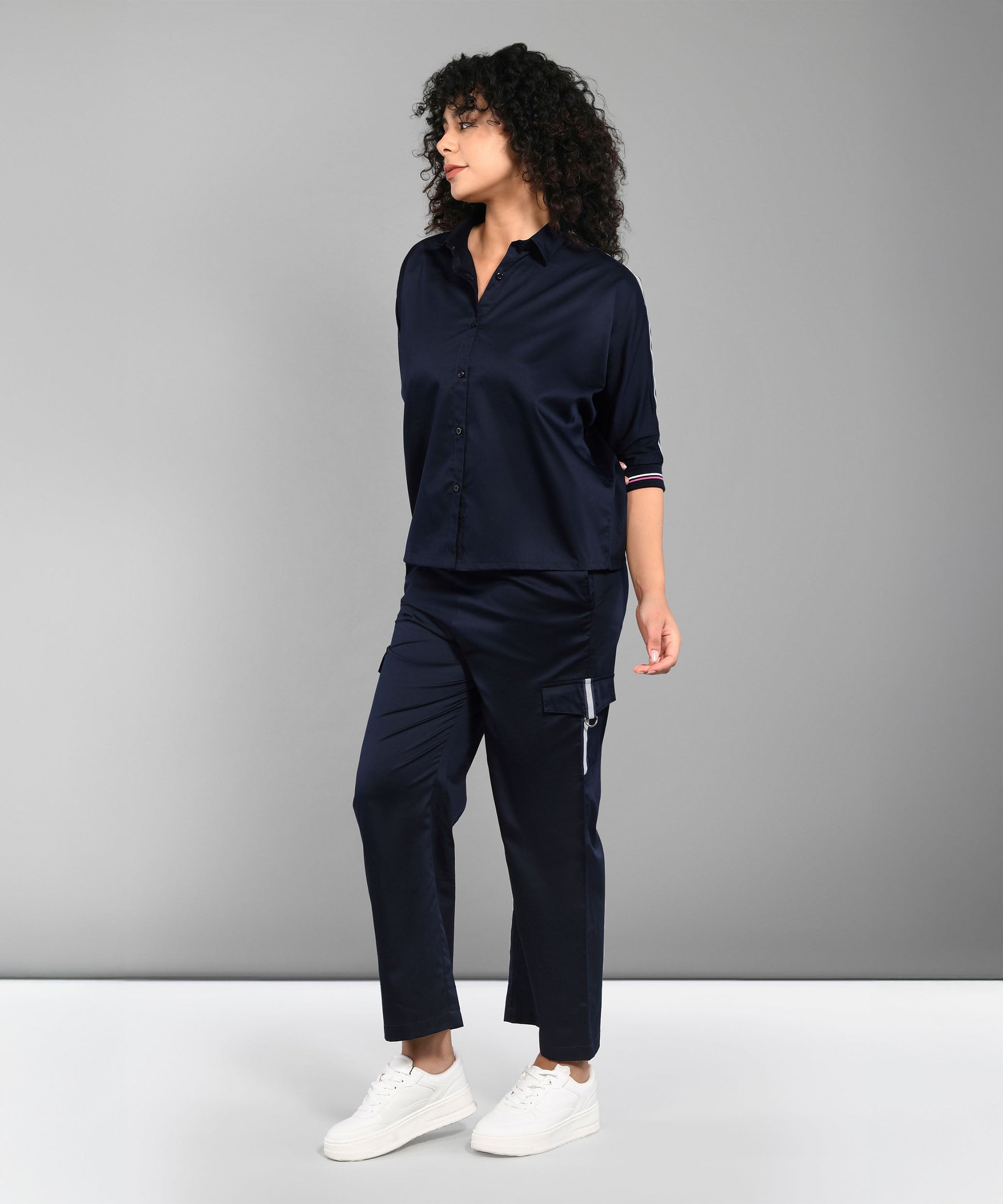 Casual women's matching set navy with a button-up top and stylish trousers for a chic look