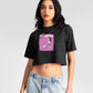 Woman wearing Stylera charcoal black oversized crop top with graphic print and light wash jeans