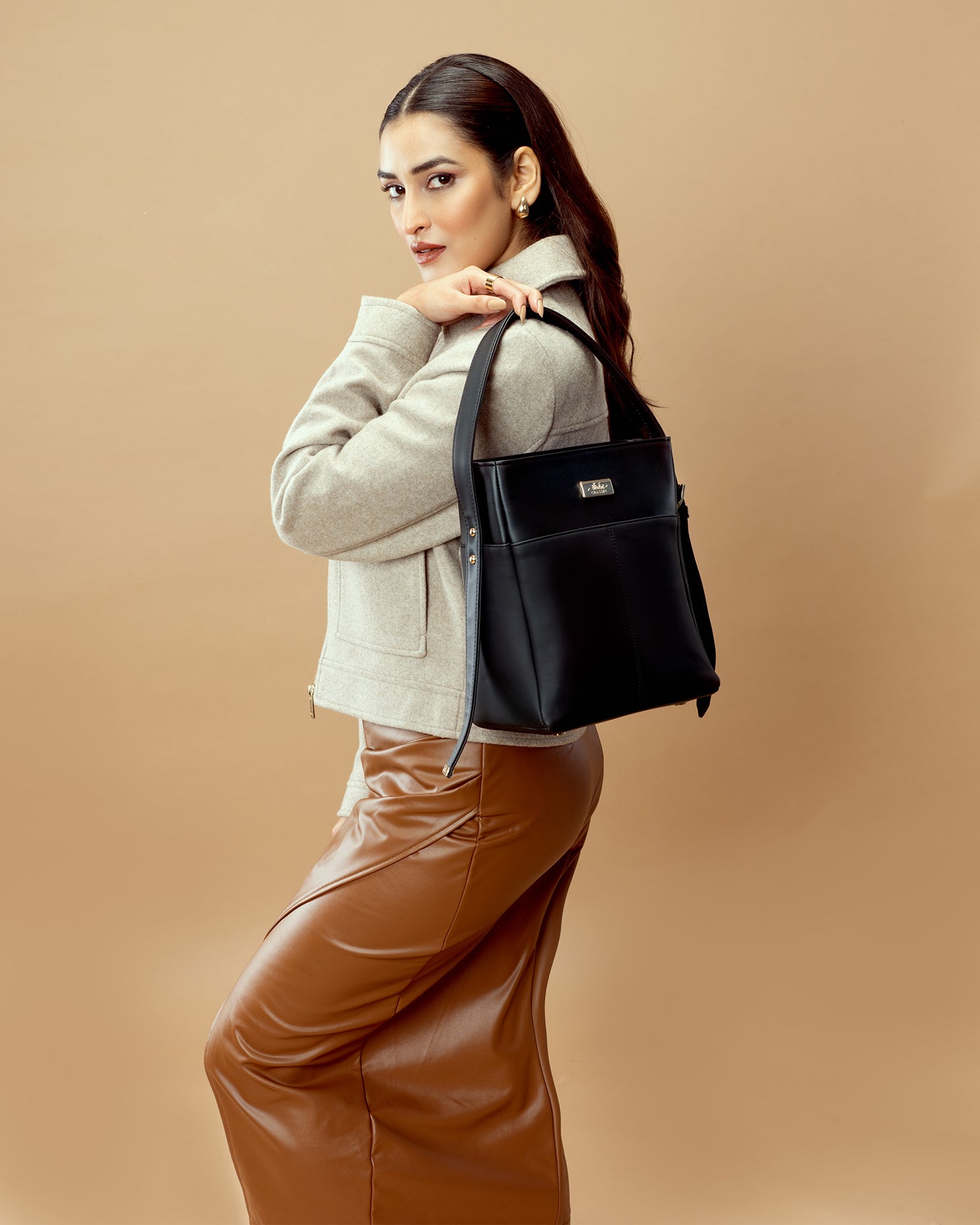 Charcoal chic bucket bag styled with a fashionable outfit for a modern look