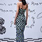 Stylera chess board cowl neck dress back view lace up straps fitted floor length gown