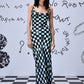 Stylera chess board cowl neck dress mint and black checkerboard maxi on a model