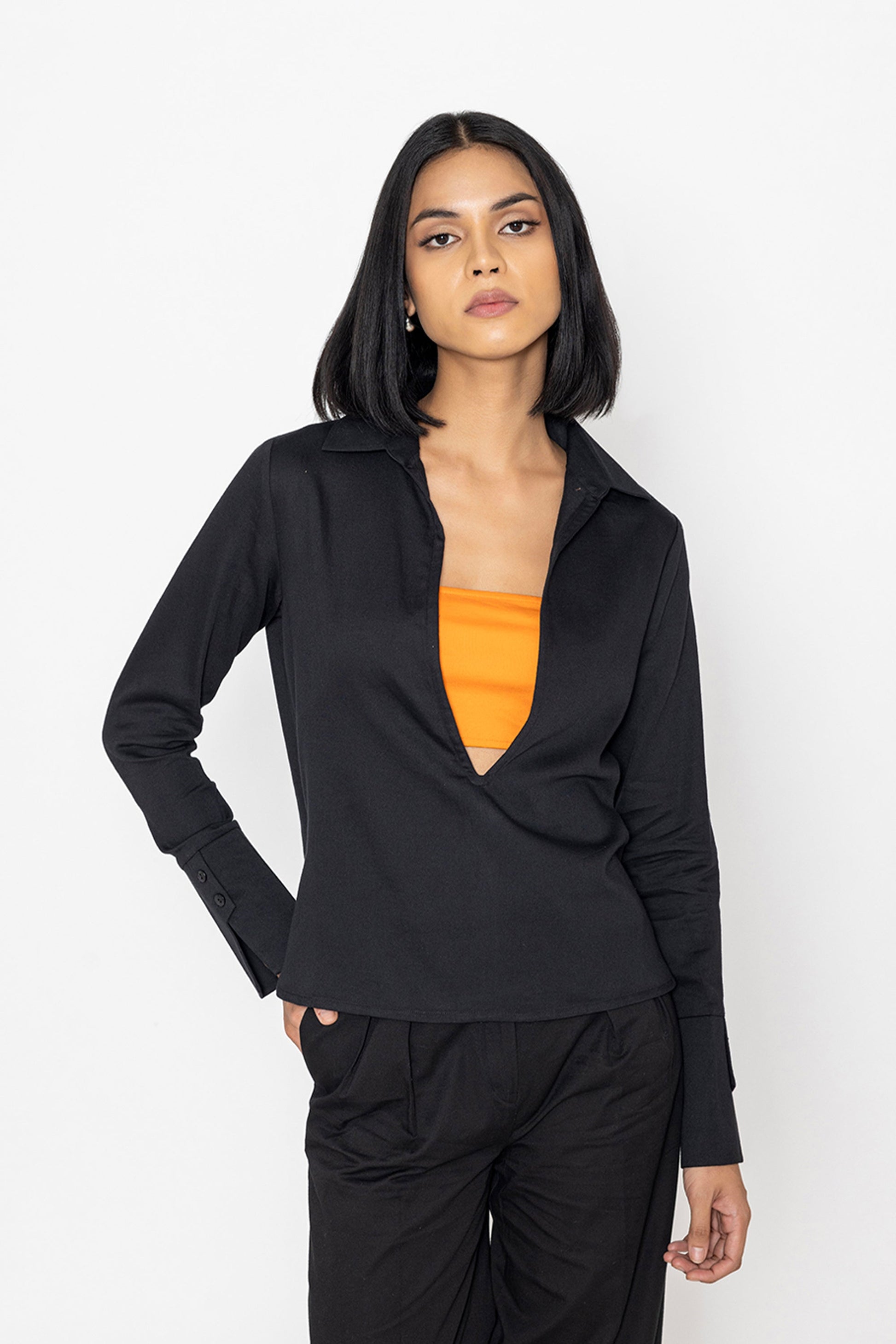 Chic black blouse for women by Stylera with long sleeves and relaxed fit