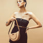 Stylish model holding a cinnamon cocoa hobo bag, perfect for chic everyday outfits