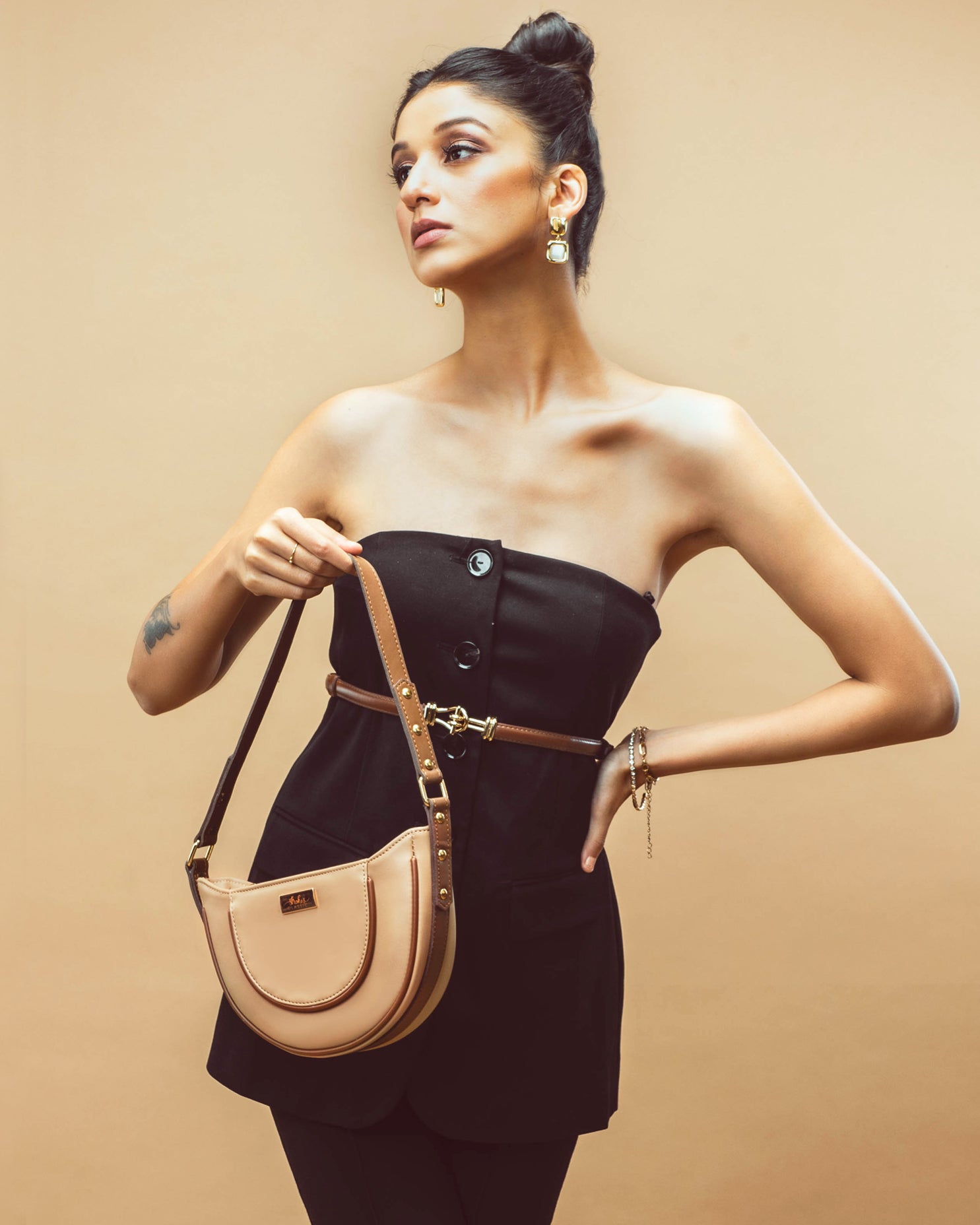 Stylish model holding a cinnamon cocoa hobo bag, perfect for chic everyday outfits