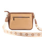 Cinnamon cocoa sling bag with stylish design and decorative strap, perfect for casual outings
