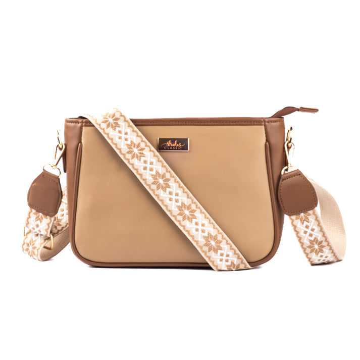 Cinnamon cocoa sling bag with a stylish patterned strap and a sleek design for casual outings