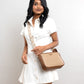 Stylish cinnamon cocoa sling bag by Stylera, worn with a white dress for a chic look
