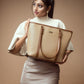 Stylish cinnamon cocoa tote bag held by a woman in a neutral outfit, perfect for everyday use