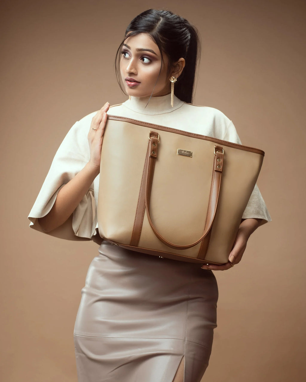 Stylish cinnamon cocoa tote bag held by a woman in a neutral outfit, perfect for everyday use