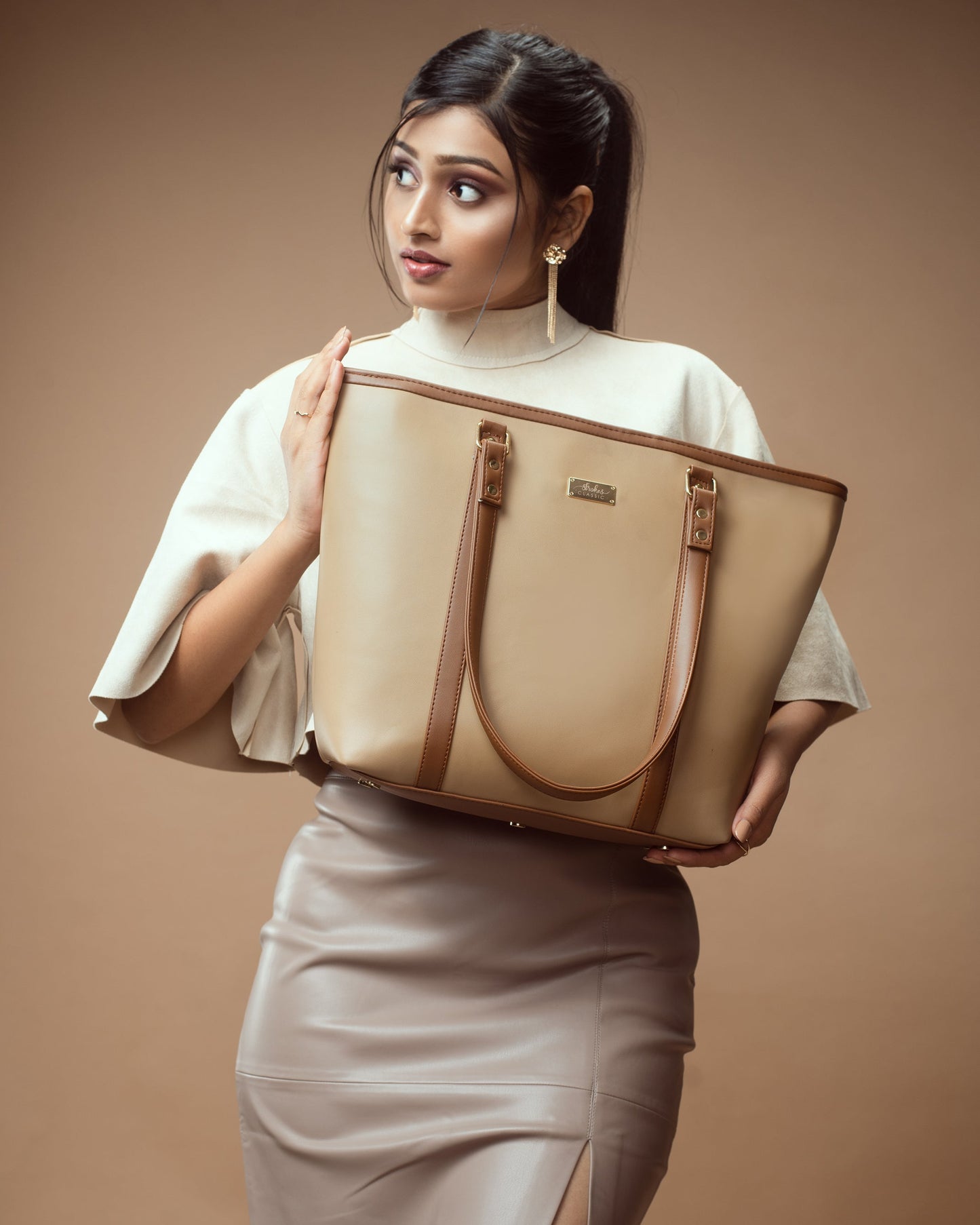 Stylish cinnamon cocoa tote bag held by a woman in a neutral outfit, perfect for everyday use