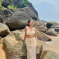 Stylera crochet two piece set with bag on model by rocky beach trendy seaside vacation outfit