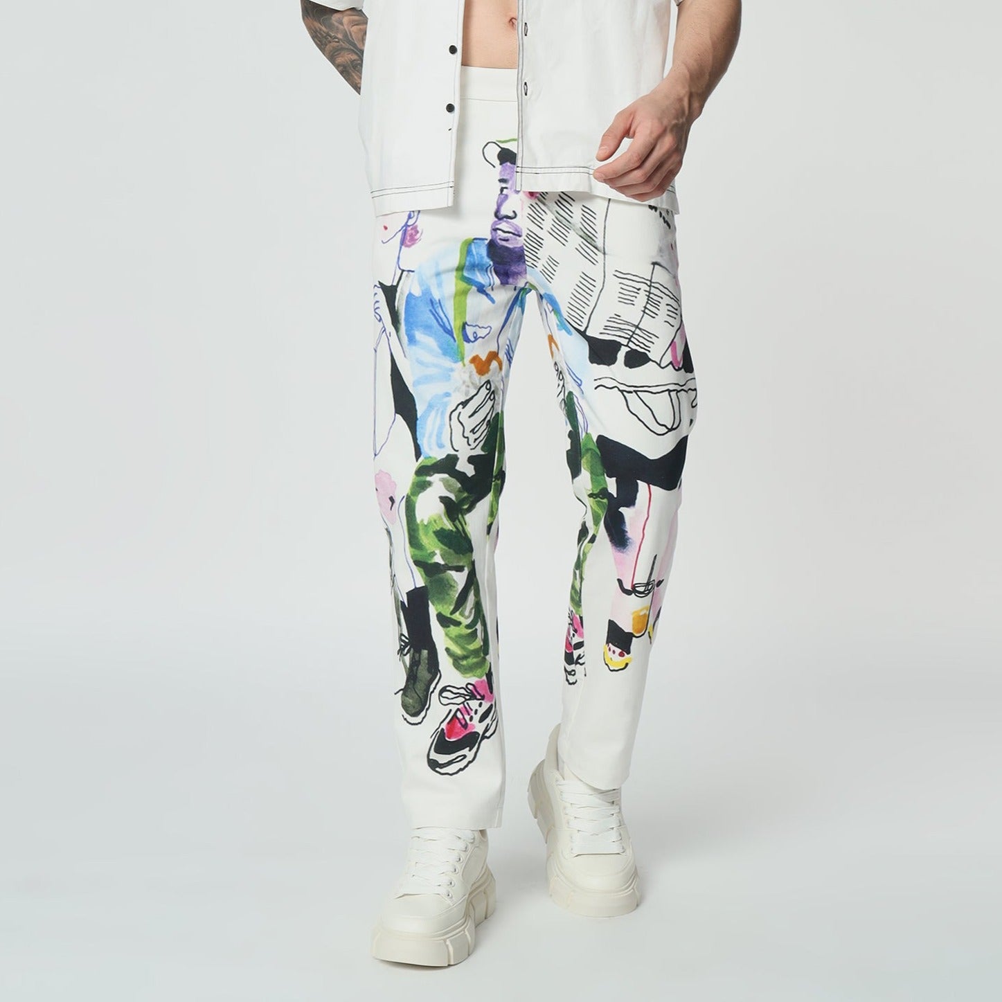 Stylera colorful designer pants for men featuring vibrant artwork and a trendy fit