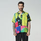 Colorful graphic button-up shirt by Stylera with vibrant abstract patterns and relaxed fit