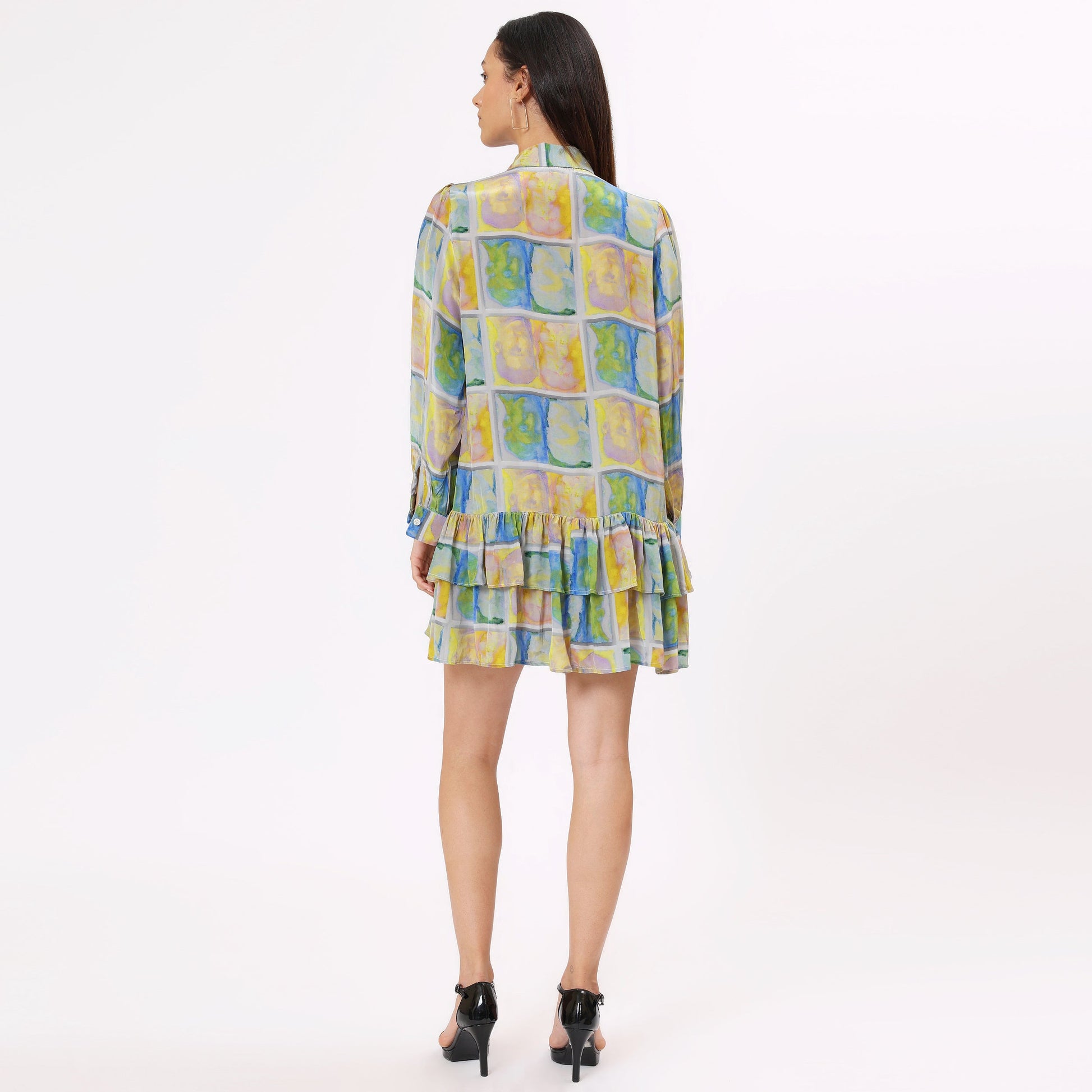 Back view of Stylera colorful long sleeve casual dress with tiered ruffles and vibrant patterns