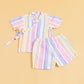 Colorful summer kimono outfit with pastel striped short-sleeve top and matching shorts for kids
