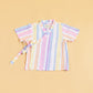 Colorful summer kimono outfit with pastel stripes and wrap closure for a vibrant look