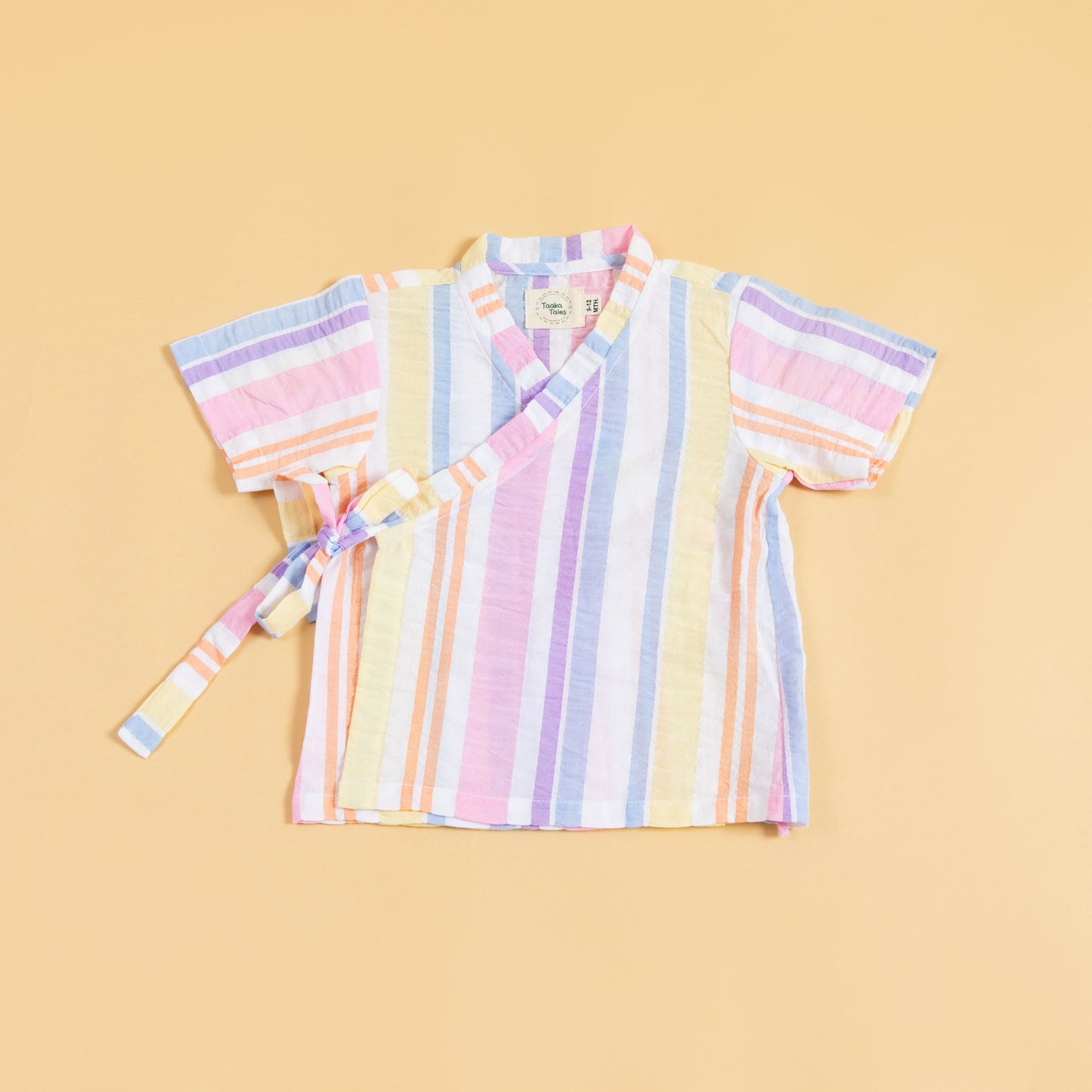 Colorful summer kimono outfit with pastel stripes and wrap closure for a vibrant look