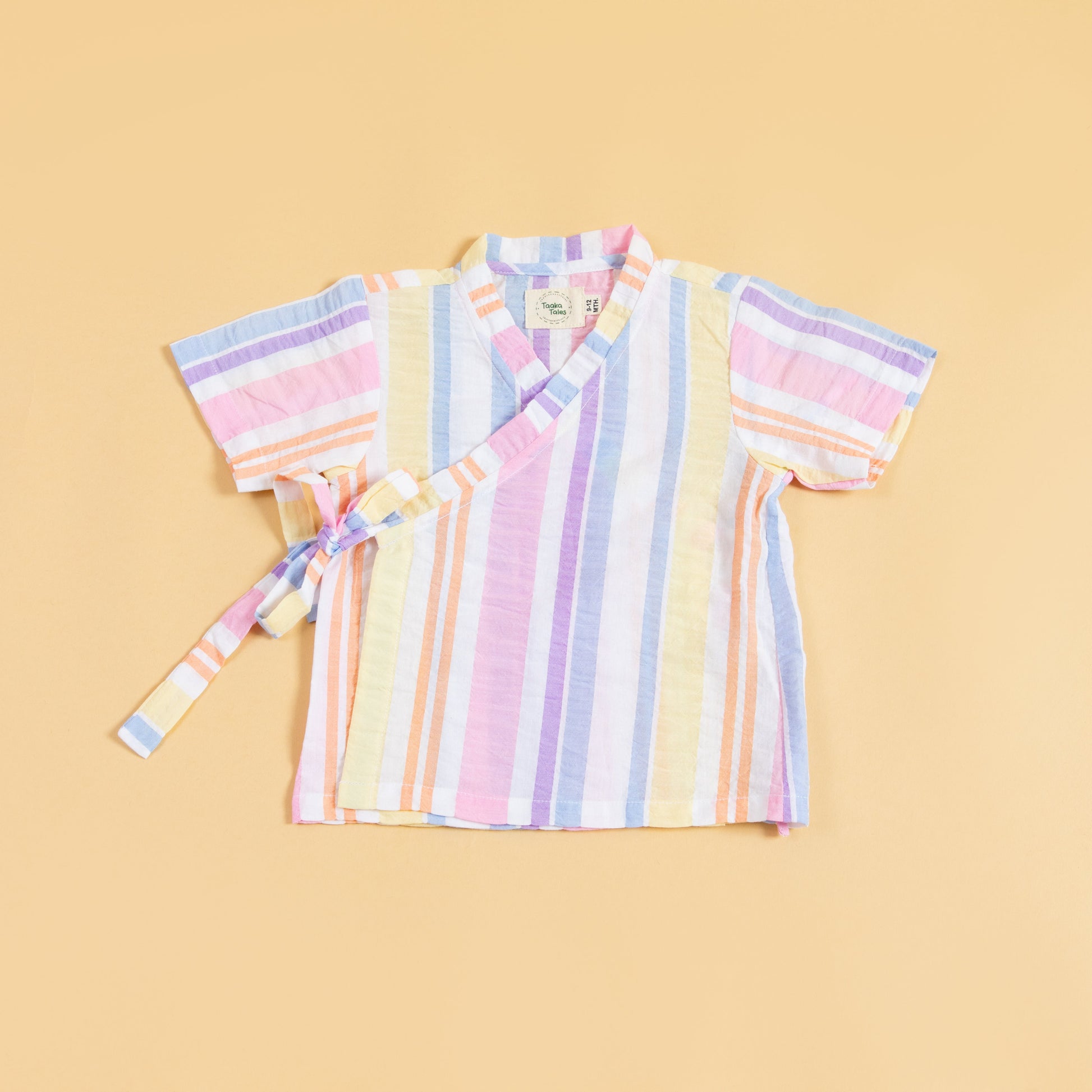Colorful summer kimono outfit with pastel stripes and wrap closure for a vibrant look