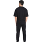 Stylera First black sweatpants rear view on model wearing matching black tee showcasing comfortable everyday sweatpants