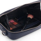 Stylera compact blue shoulder purse open showing navy interior with makeup palette brush and zipper