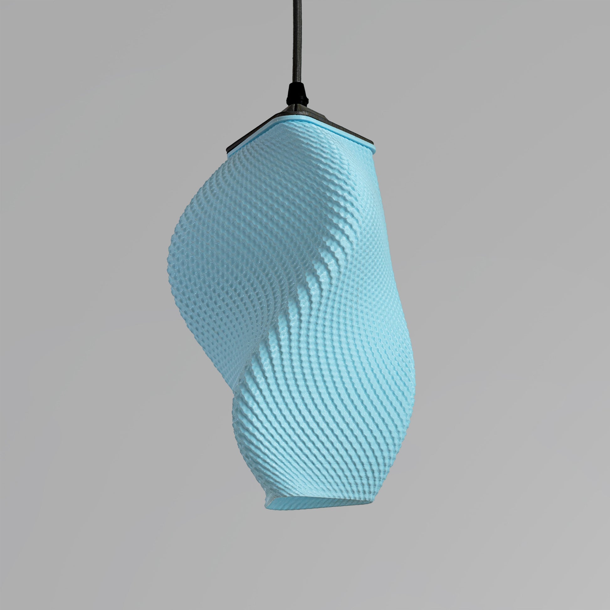 Sozori contemporary pastel accent lamp in blue with a unique twisted design for modern decor