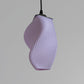 Contemporary pastel accent lamp by sozori with a unique twisted design in soft lavender color