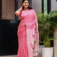 Beautiful pink cotton malmal saree with blouse featuring elegant embroidery and tassels
