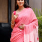 Elegant pink cotton malmal saree with blouse featuring floral designs, perfect for festive occasions