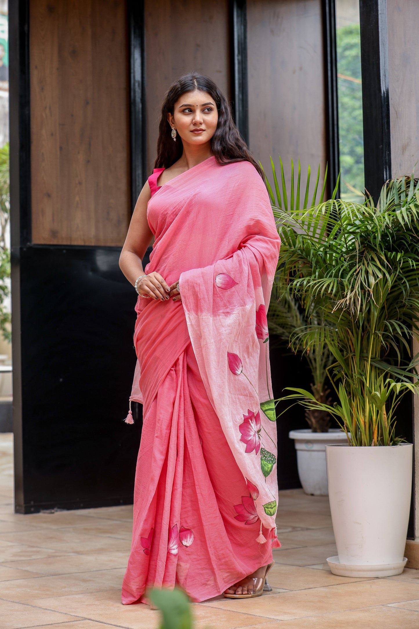 Elegant pink cotton malmal saree with blouse featuring floral designs for stylish occasions