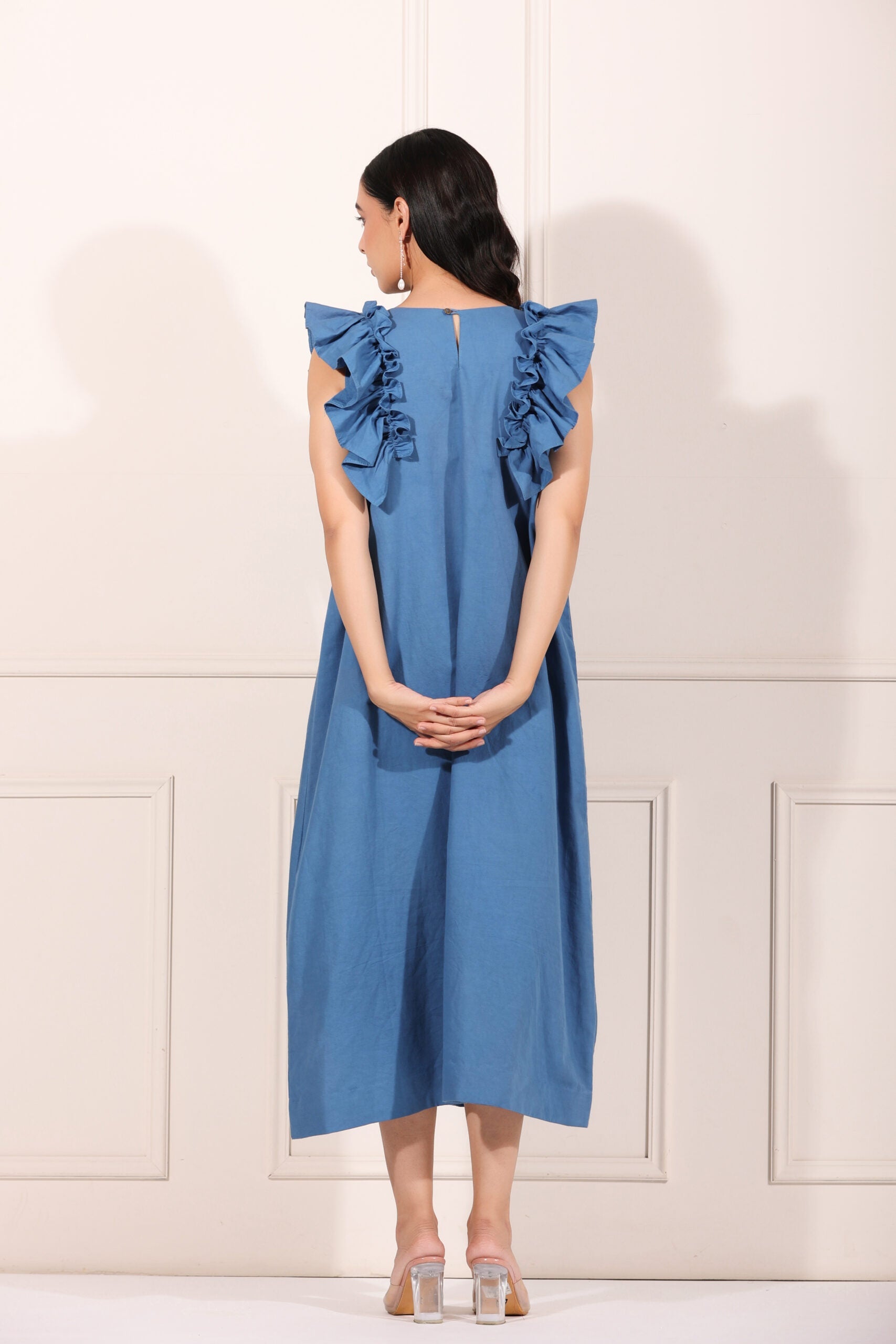 Back view of a blue cotton ruffle sleeve dress for women with elegant ruffle detailing