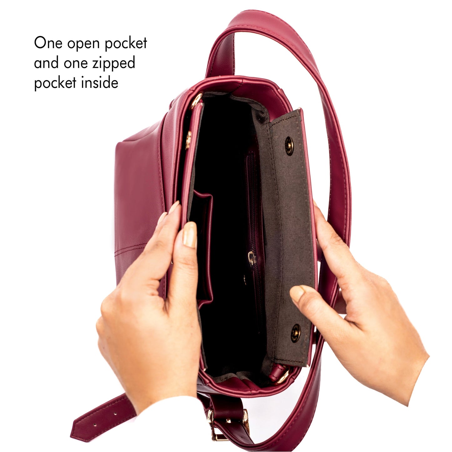 Inside view of crimson bucket bag for women showing one open pocket and one pocket with a snap closure