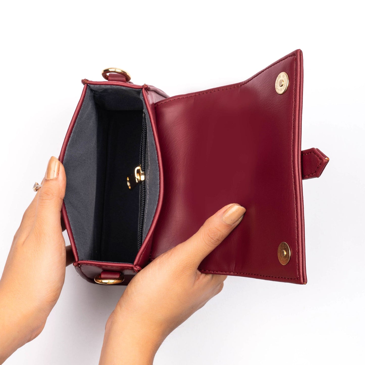 Inside view of a crimson mini sling bag with a sleek design and spacious interior