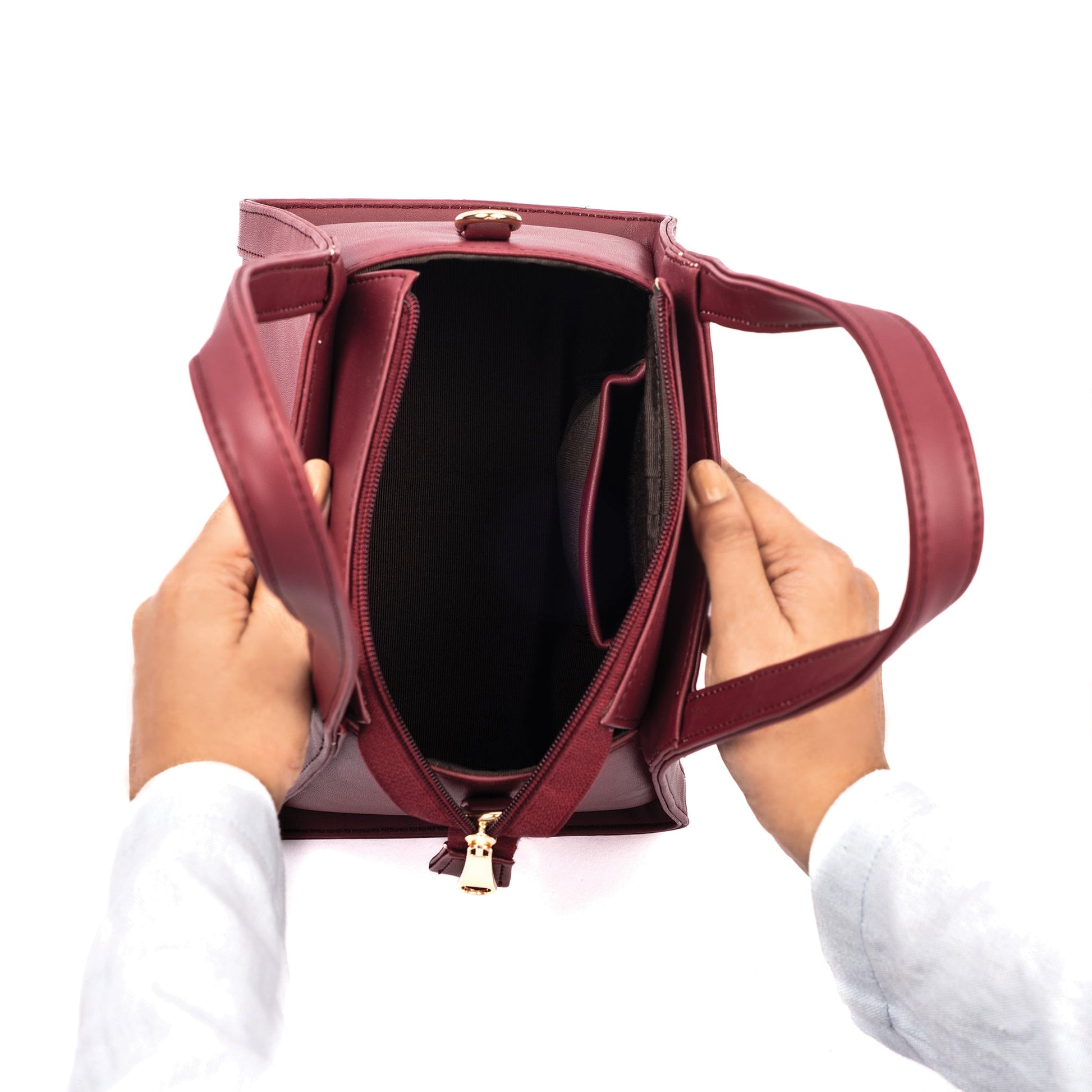 Interior view of a crimson small handbag with compartments, perfect for daily essentials