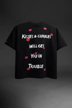 Black t-shirt with white text and red lip prints on a dark background