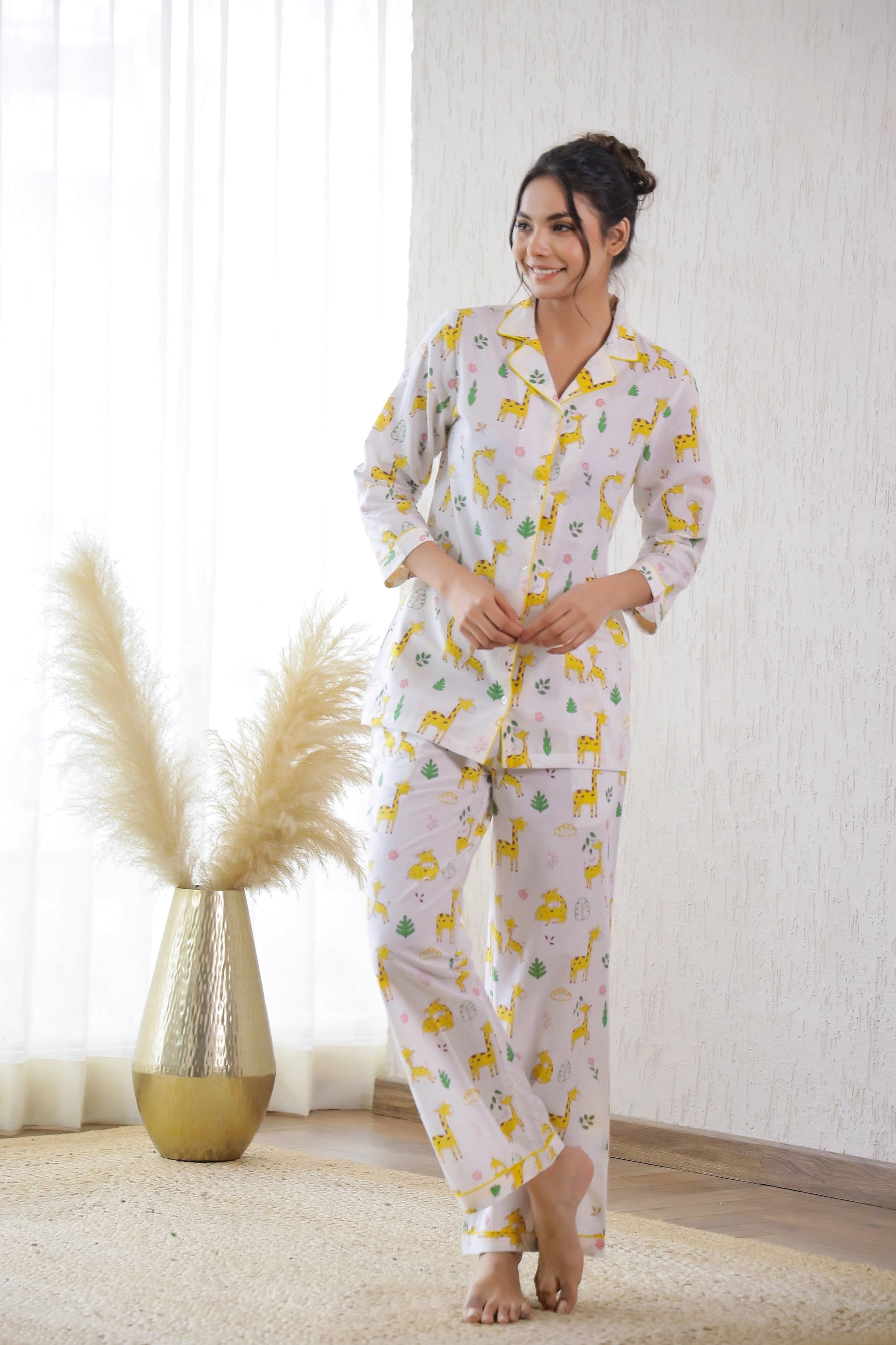 Cute animal print nightwear for women featuring a comfortable top and pants in light colors