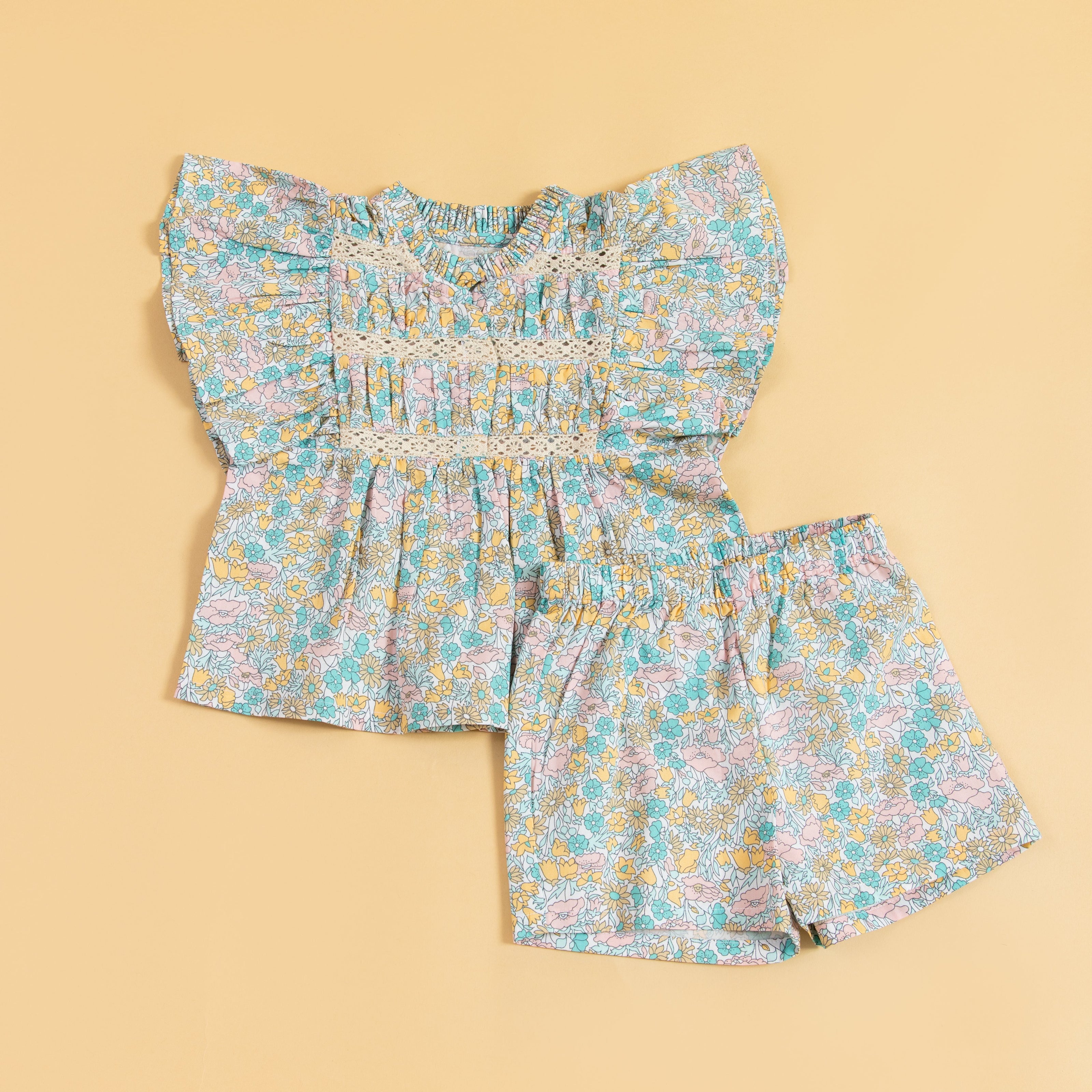 Cute floral top and shorts set in pastel colors, perfect for warm summer days