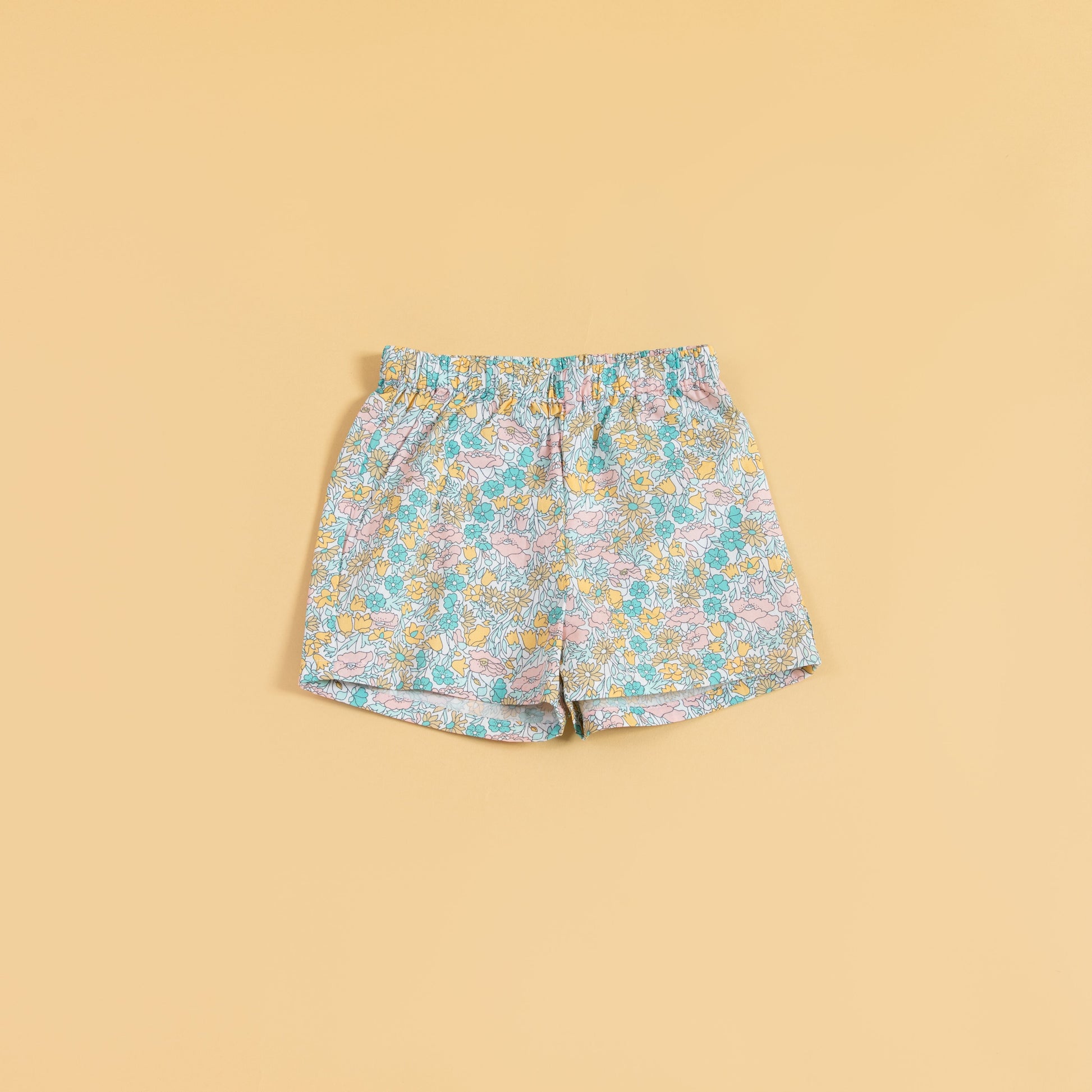 Cute floral top and shorts set featuring colorful floral patterns and comfortable elastic waistband