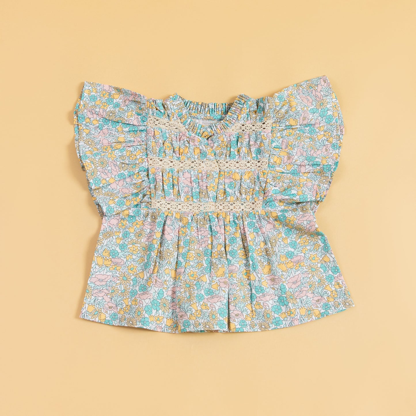 Cute floral top and shorts set featuring a ruffled, colorful design perfect for summer outfits