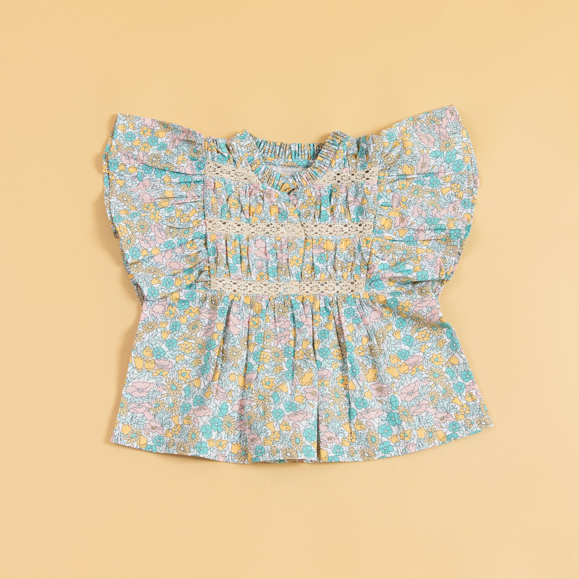 Cute floral top and shorts set featuring a ruffled, colorful design perfect for summer outfits